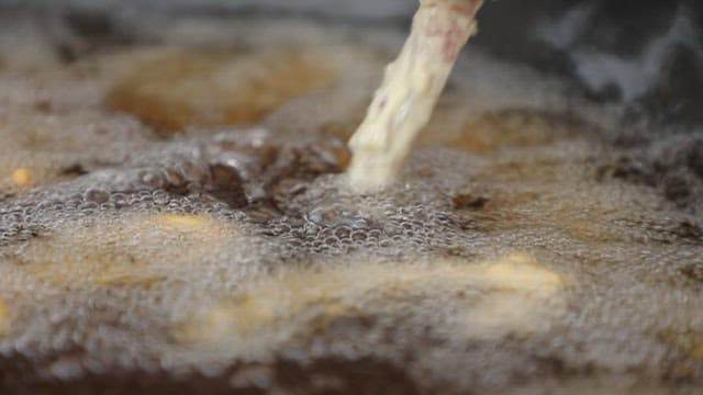 Pork batter fried in hot boiling oil
