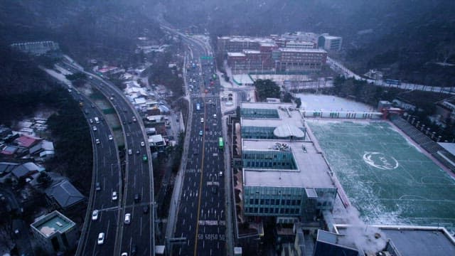 Snowy Cityscape with Traffic Flow