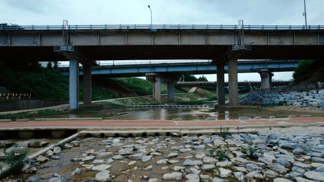 Bridge over a stream on a cloudy day