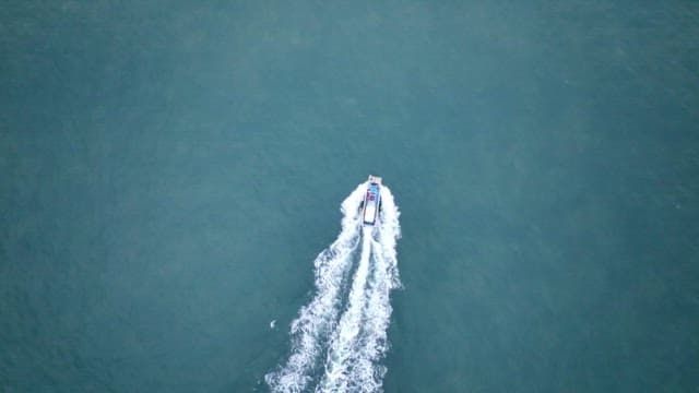 Boat moving swiftly over the open sea