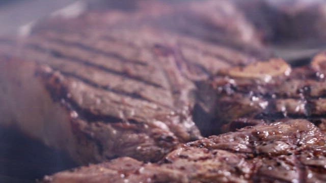 Delicious Steak Grilled on a Hot Iron Plate