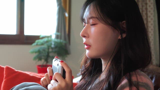 Woman listening to music indoors