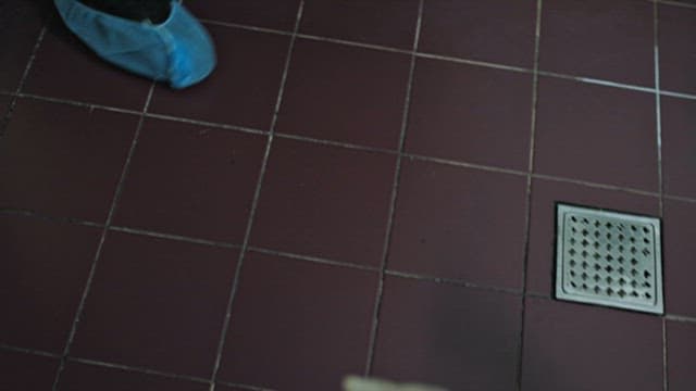 People Examining the Bathroom Floor, the Crime Scene