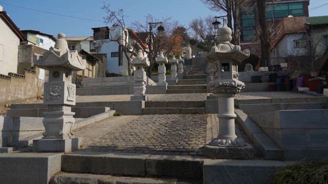 Traditional stone lanterns lining a staircase