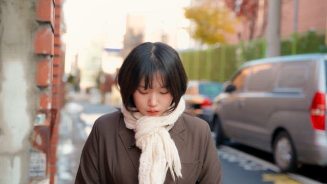 Student walking on the street in winter