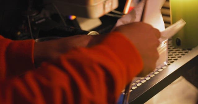 Person Breaking Eggs for Cooking