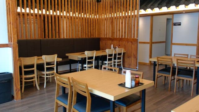 Quiet interior of restaurant with charming traditional wooden design