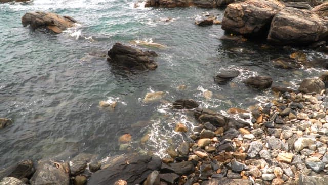 Rocky shoreline with waves crashing