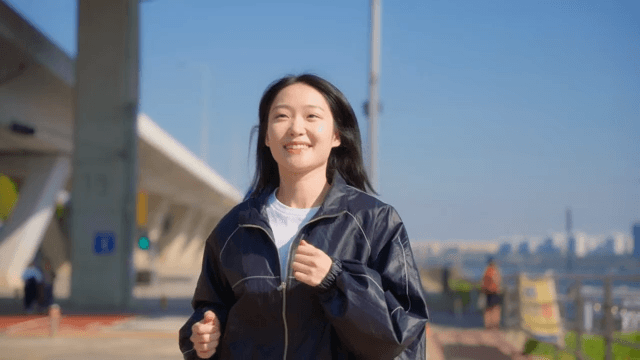 Woman jogging with a smile