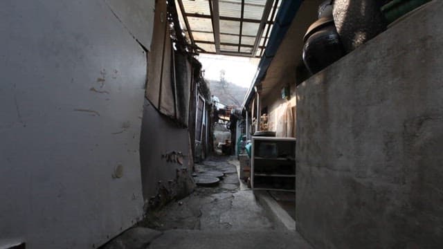 Weathered alleyway between traditional houses