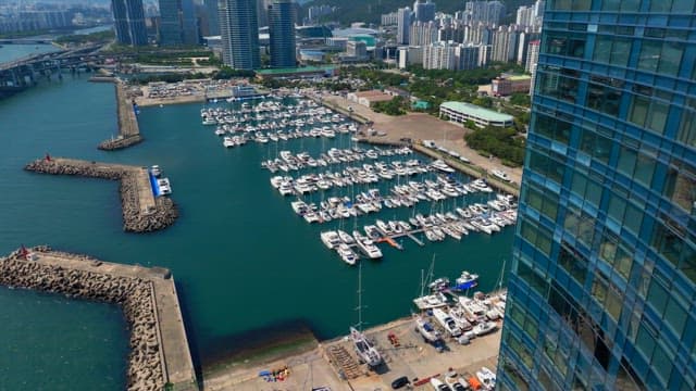 Busan's coastline with skyscrapers and yacht marinas