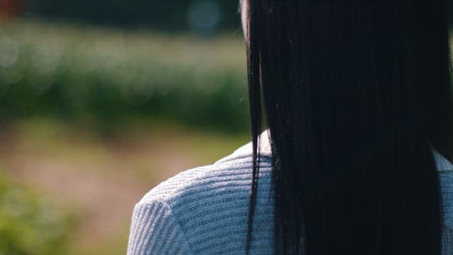 Serene Woman Overlooking Corn Fields