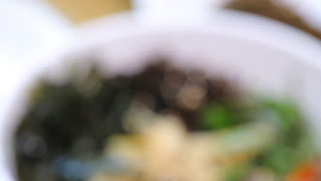 Bowl of fresh Korean bibimbap with seaweeds