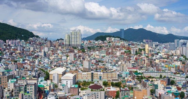 Urban view with densely packed buildings under a cloudy sky
