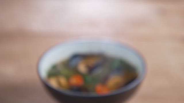 Seafood soup with a rich broth filled with fresh vegetables and mussels