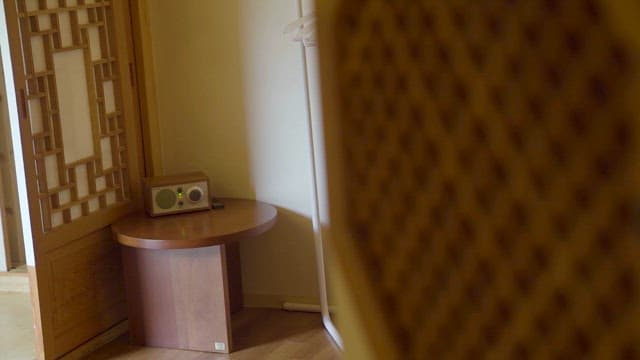Retro-style radio on a wooden table indoors
