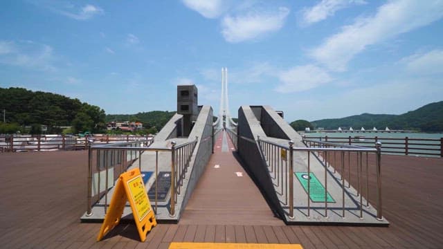 Pedestrian Bridge in Waterside park on a sunny day