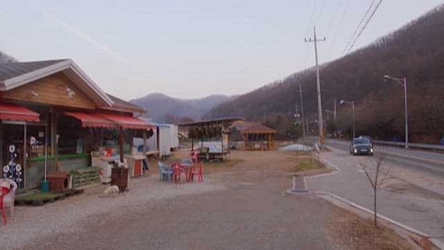 Car Moving to a Store on a Quiet Driveway