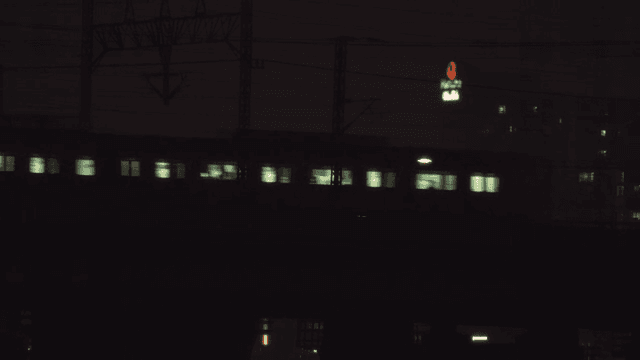 Late night train passing through the city