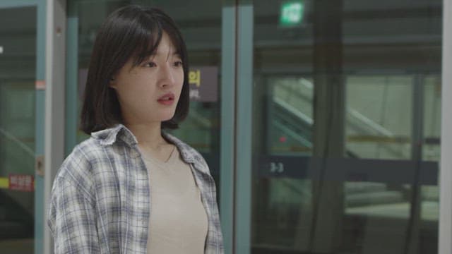 Person standing on empty subway platform in city