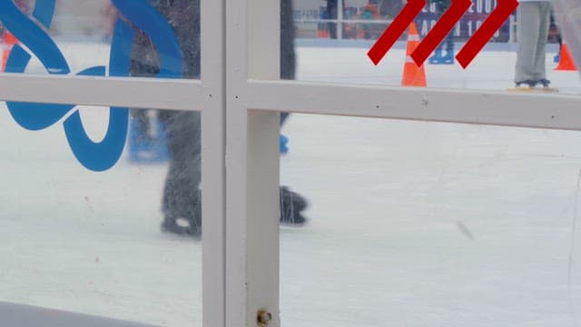 People ice skating at an outdoor rink