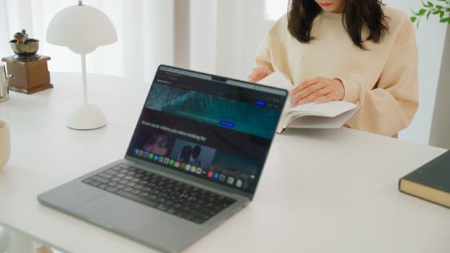 Two people enjoying leisure time at the white table in the living room
