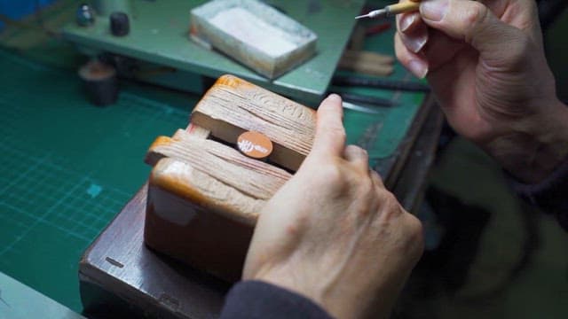 Craftsman Painting on Wooden Crafts