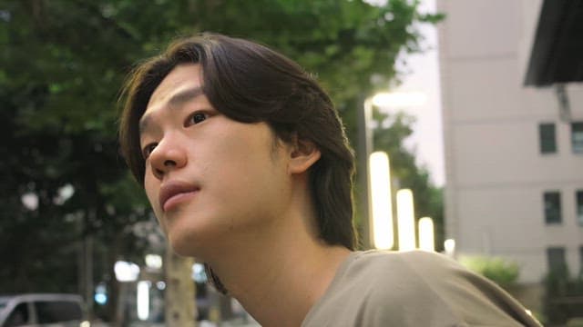 Man looking around on city street