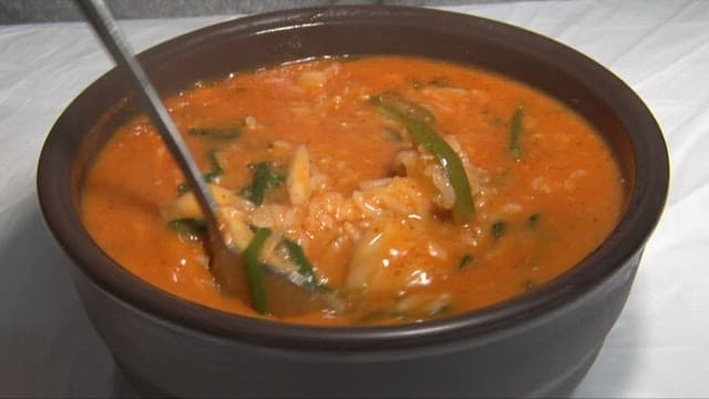 Spoon of Spicy and Thick Seafood Porridge