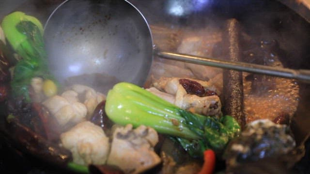 Chinese chicken dish with lots of spices and vegetables