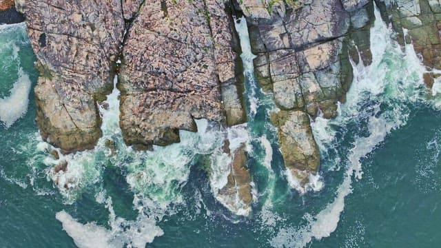 Waves crashing against rocky cliffs