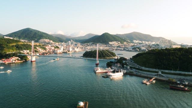Coastal Cityscape with Bridge and Boats
