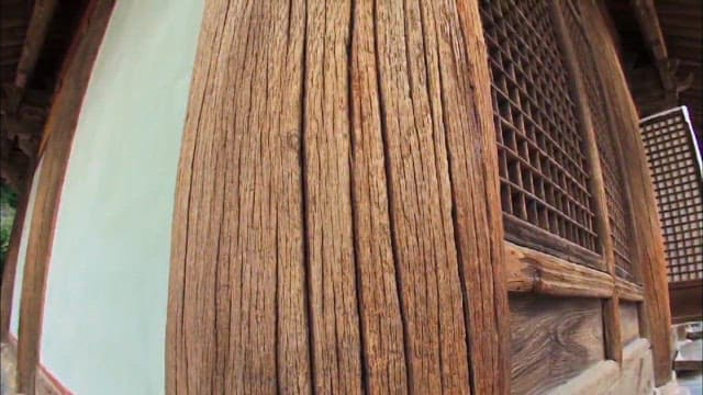 Up-close texture of an ancient wooden pillar of a traditional Korean house