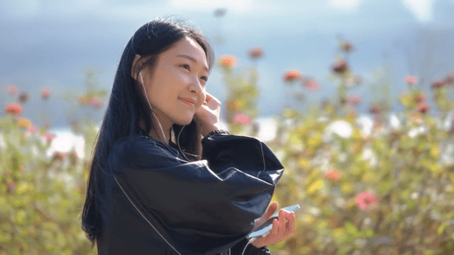 Woman listening to music outdoors