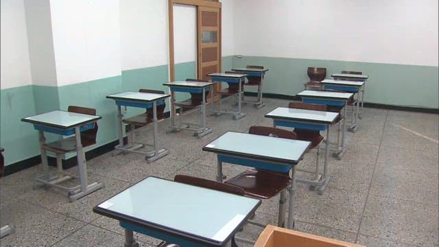 Empty Classroom with Desks and Chairs