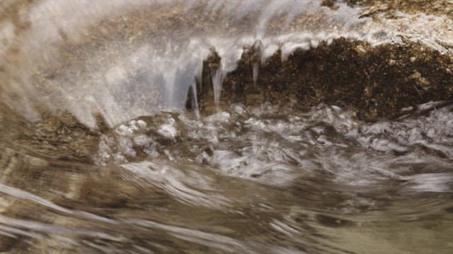 Flowing Stream Water Over Rocky Surface