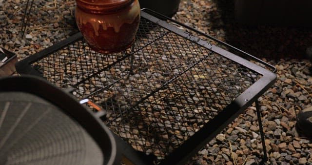 Preparing seafood on a grill outdoors