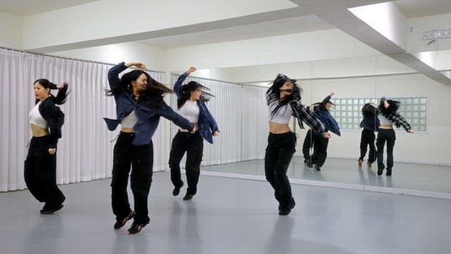 K-POP Dancers Practicing in a Studio