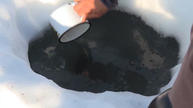Collecting Water from a Hole in the Ice