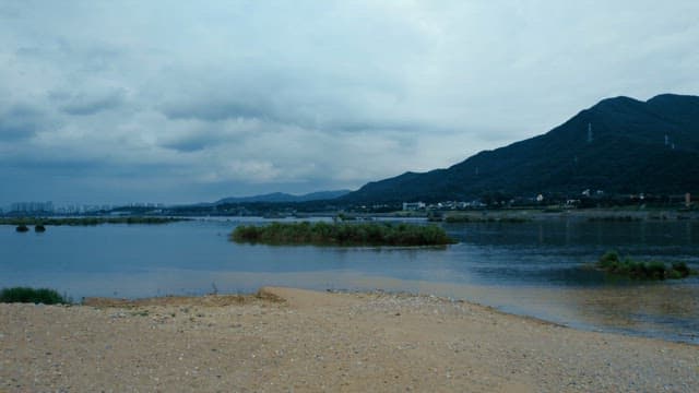 A calm river with distant mountains