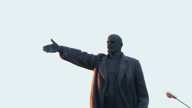 Lenin Statue in the city square during morning light.