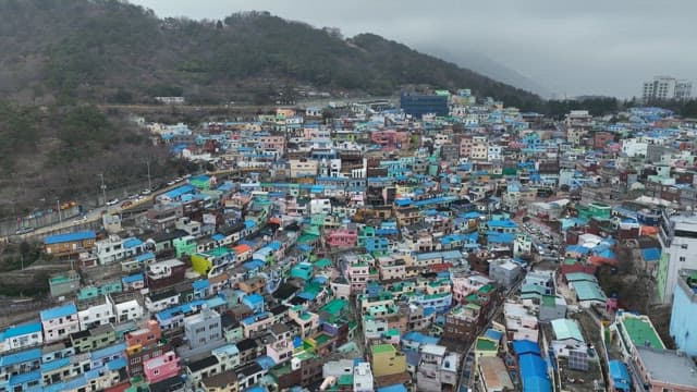 Colorful hillside village with vibrant rooftops