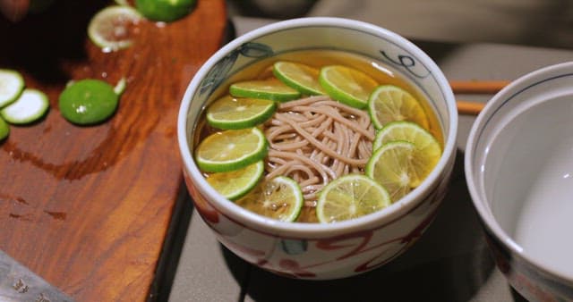 Slicing Limes for Noodle Soup Preparation