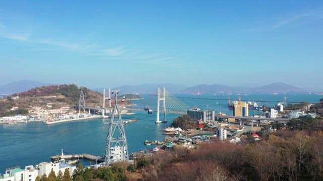 Cable car in Yeosu with a view of Dolsandaegyo Bridge over the sea