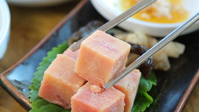 Fresh skate liver dipped in oil sauce