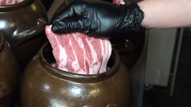 Samgyeopsal Placed in Clay Pots for Aging