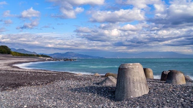 Rocky beach with distant mountains