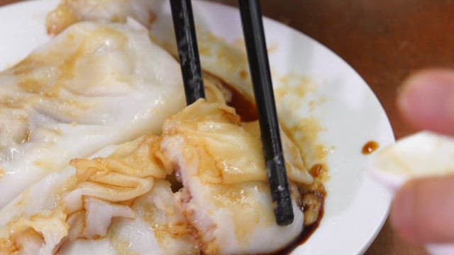 Enjoying Savory Dumplings with Sauce