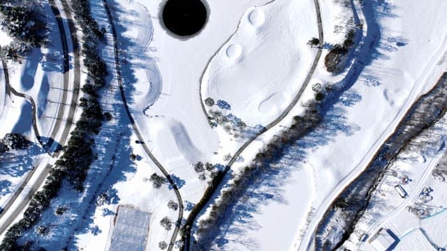 Snow-covered Landscape with Mountains and Trees