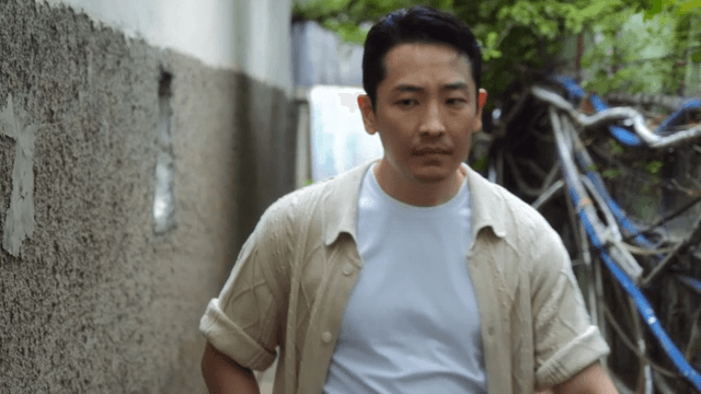 Man walking down a narrow alley